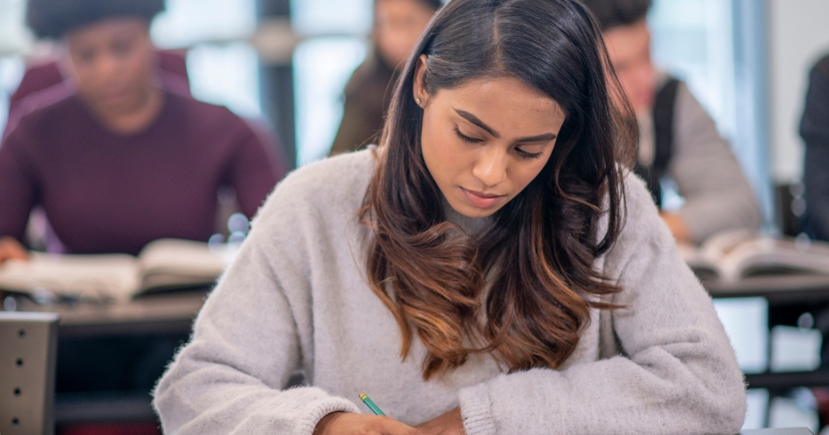 A PSC exam aspirant studying with books, notes, and a timetable, focusing on effective