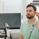 Audiologist performing a hearing test using advanced equipment in a modern clinic.